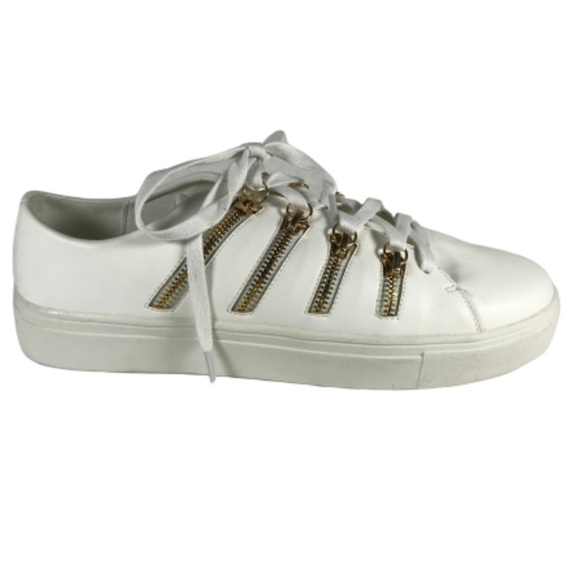 white sneakers with gold zipper